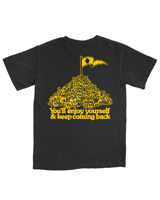 Black t-shirt with yellow graphic and text 'You'll enjoy yourself & keep coming back'
