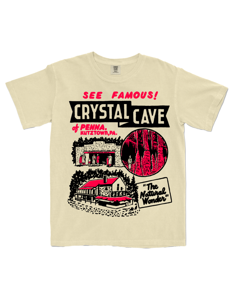 Beige t-shirt with 'Crystal Cave' graphic design on a white background