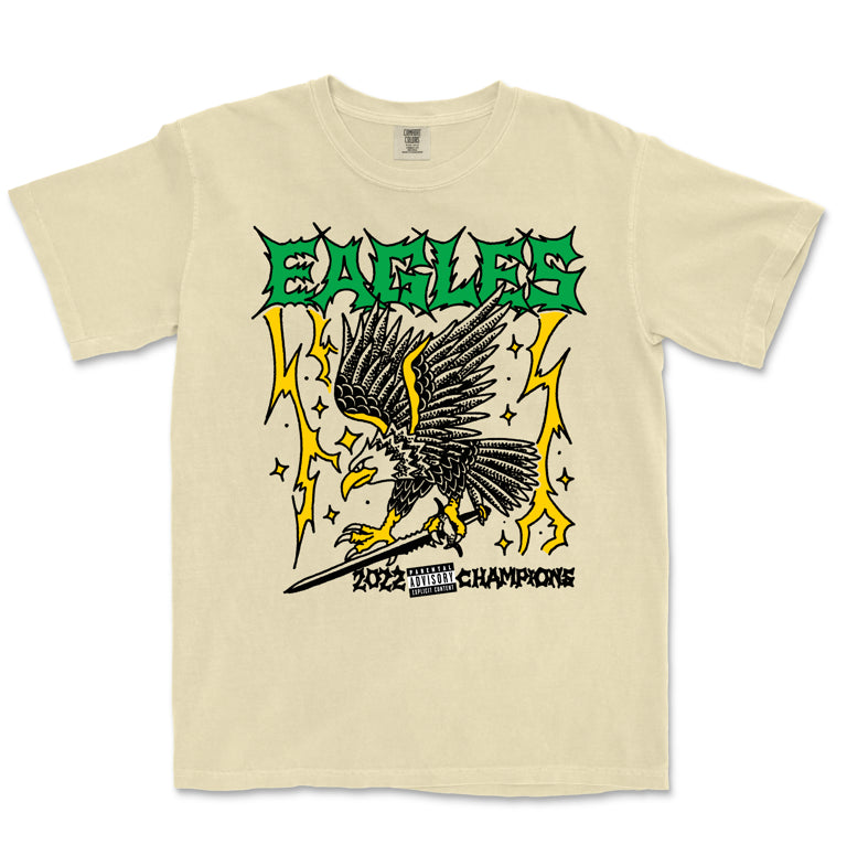 Beige t-shirt with eagle graphic and 'EAGLES' text on a white background