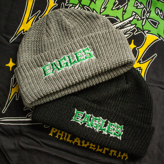 Two beanies with 'EAGLES' branding on a colorful background