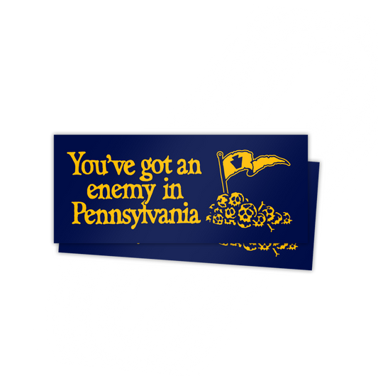 Two stickers with yellow text "You've got an enemy in Pennsylvania" and a flag graphic on a blue background