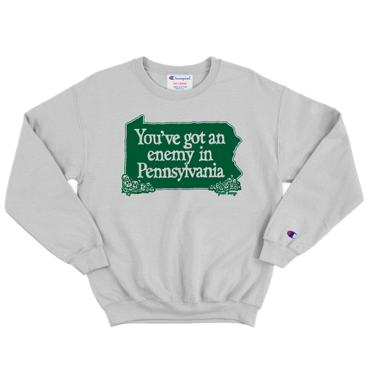 Gray sweatshirt with green graphic and text 'You've got an enemy in Pennsylvania'