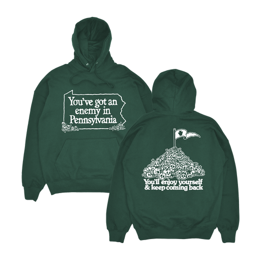 Green hoodie with text 'You've got an enemy in Pennsylvania' on the front and 'You'll enjoy yourself & keep coming back' on the back