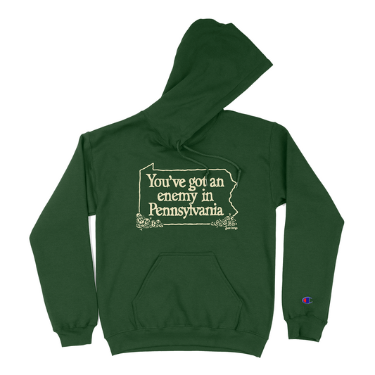 Green hoodie with text design 'You've got an enemy in Pennsylvania'