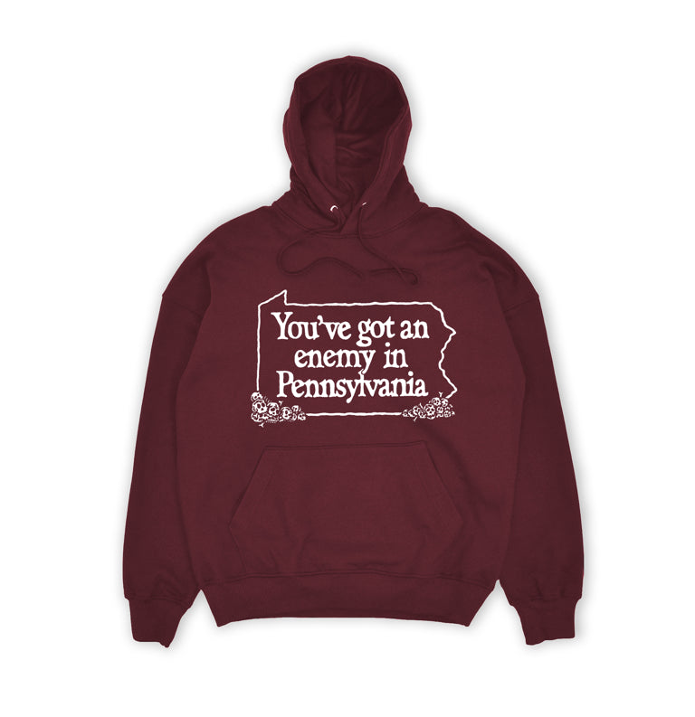 Maroon hoodie with white text 'You've got an enemy in Pennsylvania' on a white background