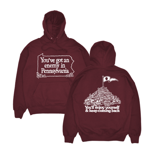 Maroon hoodie with text 'You've got an enemy in Pennsylvania' and graphics on front and back