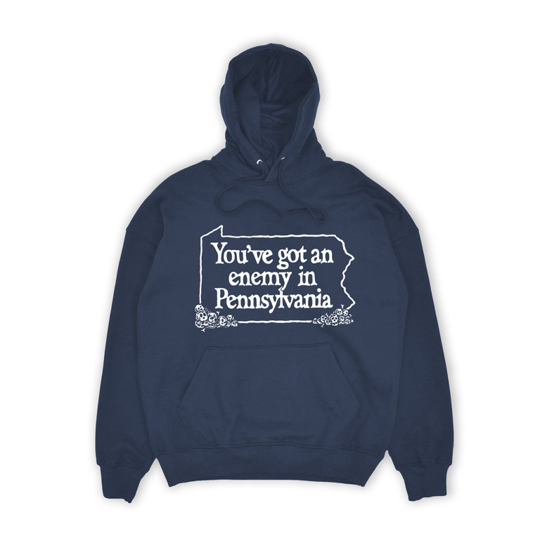 Navy blue hoodie with white text 'You've got an enemy in Pennsylvania' on a white background