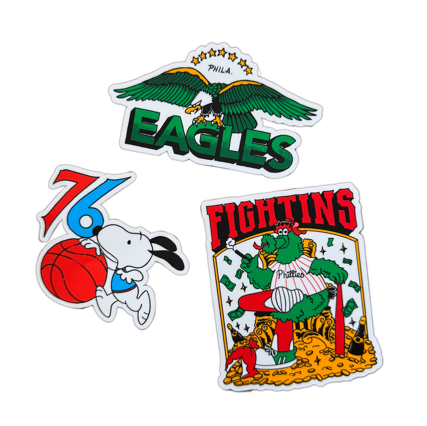 Three colorful stickers featuring an eagle, a cartoon character with a basketball, and a card-themed design on a white background.