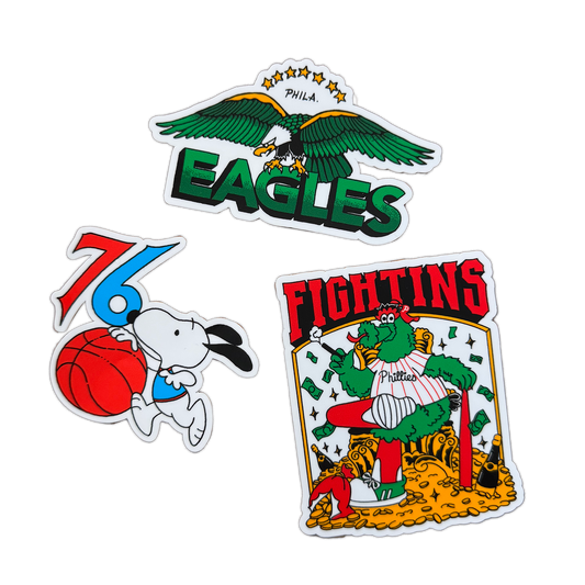 Three colorful stickers featuring an eagle, a cartoon character with a basketball, and a card-themed design on a white background.