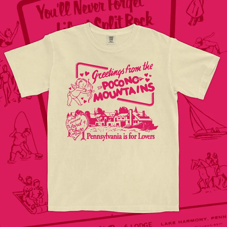 Beige t-shirt with pink Poconos text and graphics on a pink background