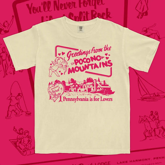 Beige t-shirt with pink Poconos text and graphics on a pink background