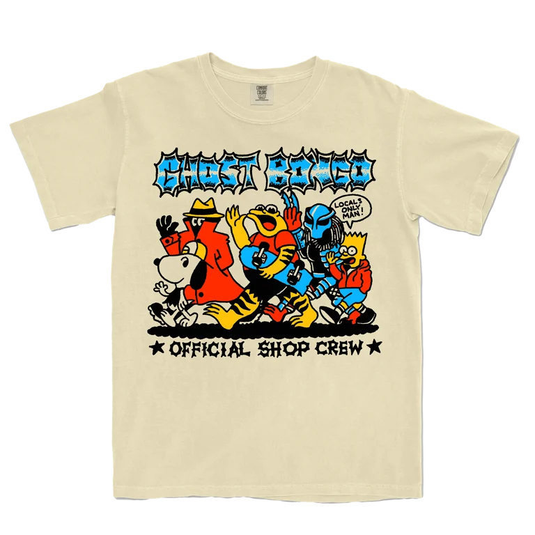 Beige t-shirt with colorful graphic design featuring cartoon characters and text on a transparent background