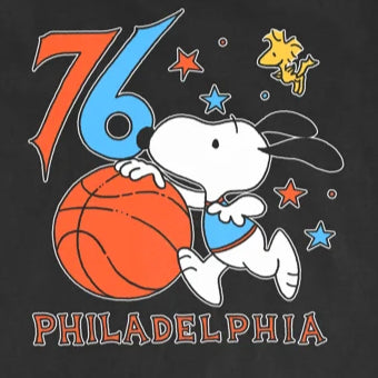 Black t-shirt with a graphic of Snoopy playing basketball and the number 76, on a white background.