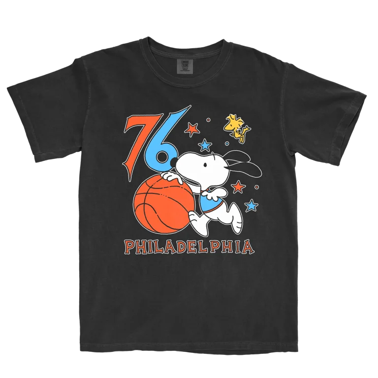 Black t-shirt with a graphic of Snoopy playing basketball and the number 76