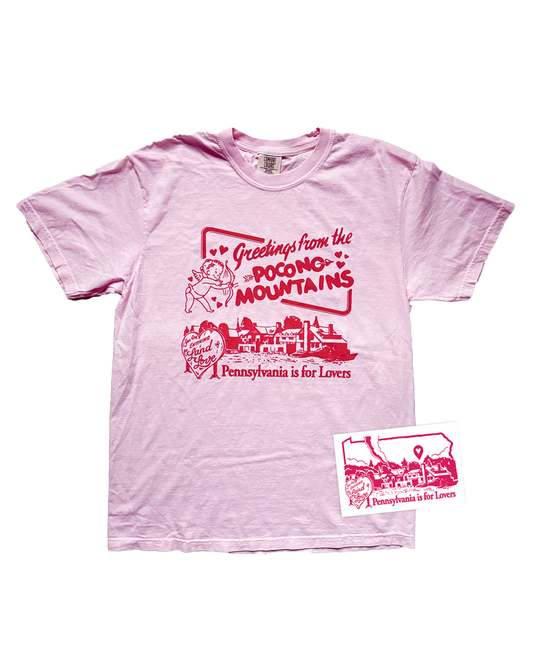 Pink t-shirt with red graphic design on a white background